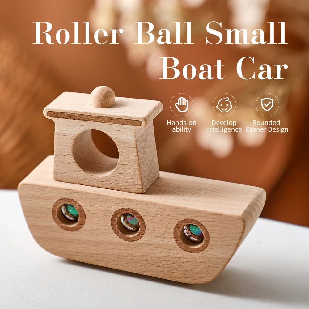 Front view of a wood-grain toy boat with a raised cabin and three colorful rolling marbles.