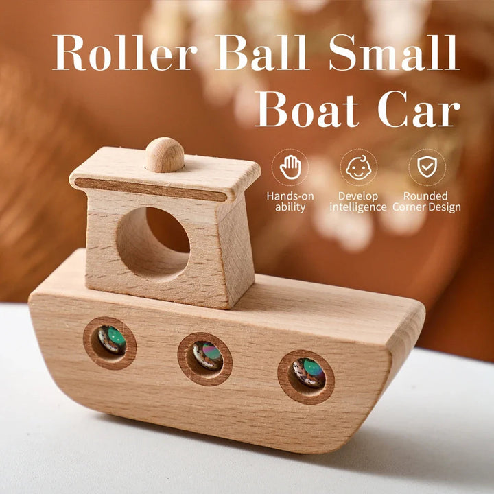 Front view of a wood-grain toy boat with a raised cabin and three colorful rolling marbles.