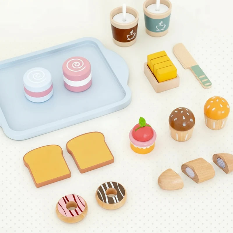Wooden Breakfast set pieces arranged around a blue tray, including cakes, toast, and cups