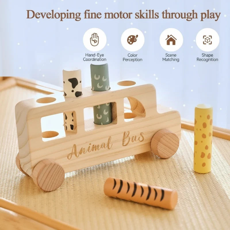 Wooden bus with two pegs inserted and two beside it, illustrating fine motor play