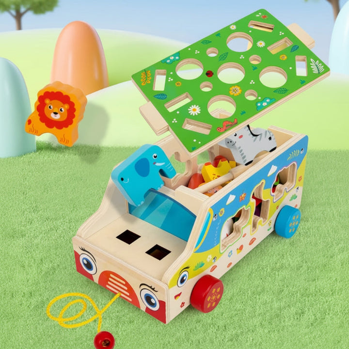 Wooden activity bus with the sorting lid lifted to reveal animal pieces inside