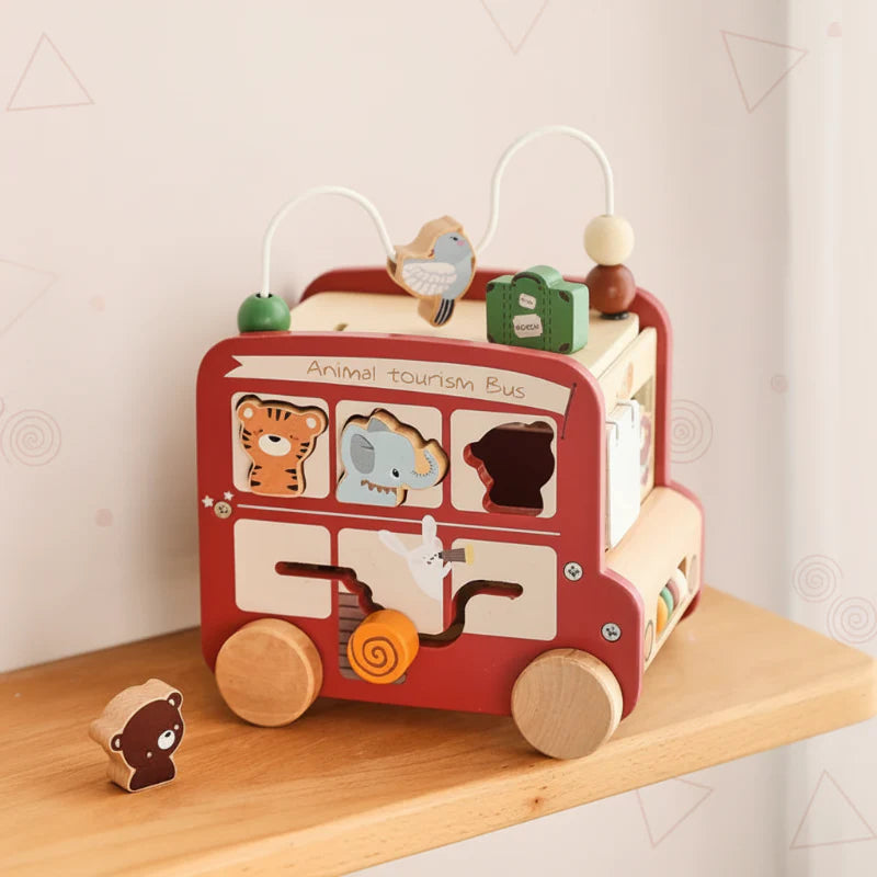 Animal shape-sorter side of the red bus with a sliding maze and bead loops on top