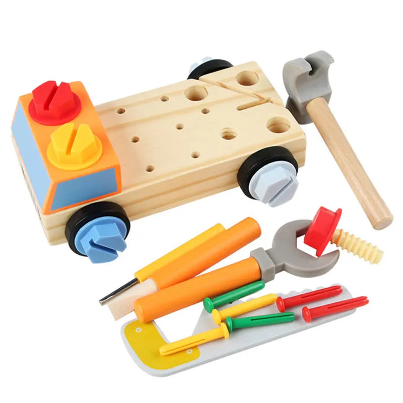 Wooden activity car beside a toy hammer, wrench, screwdrivers, saw and loose fasteners