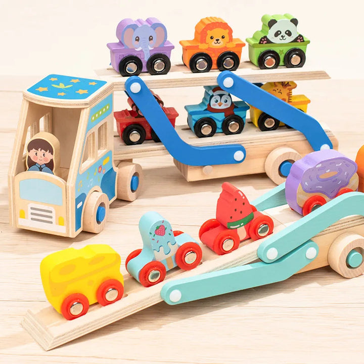 Animal and food-themed vehicles displayed on wooden carrier trucks with folding ramps.