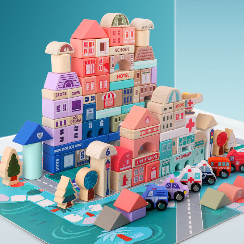Stacked wooden city buildings and toy vehicles arranged on a road puzzle mat
