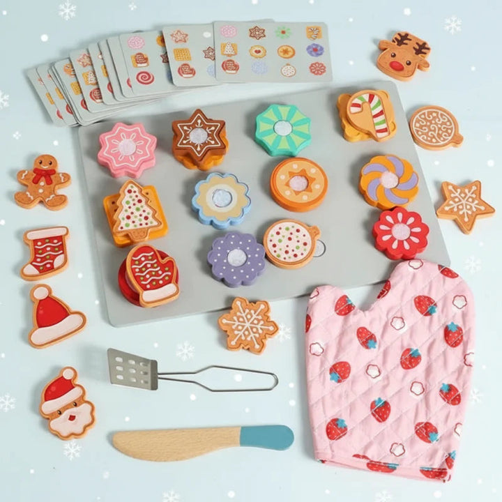 Wooden cookie sorting set with a tray, colorful cookies, pattern cards, toy knife, spatula, and pink oven mitt.