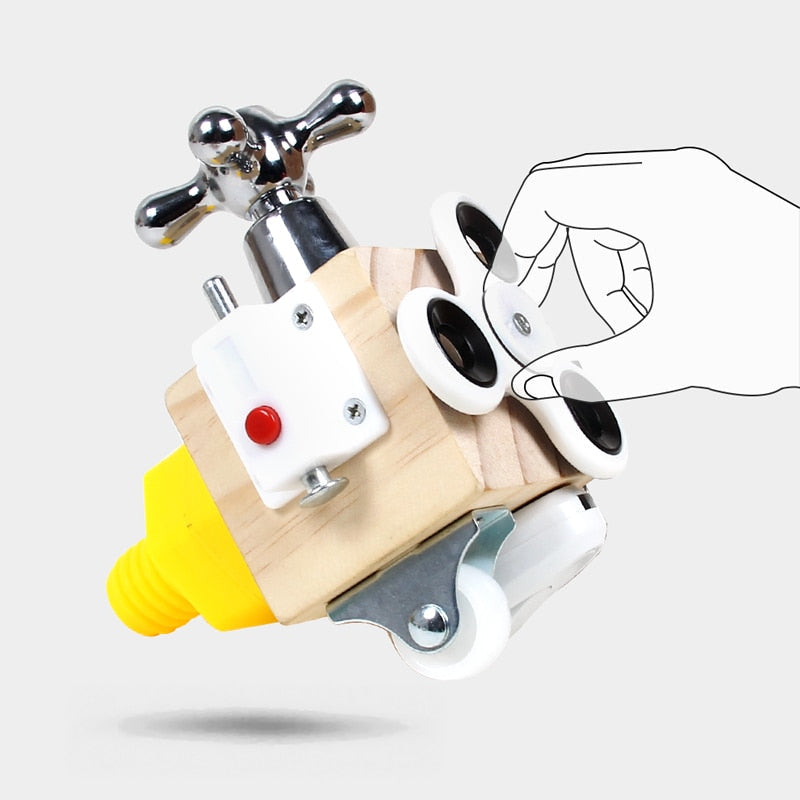 Wooden sensory cube with a hand illustration demonstrating the white three-arm spinner