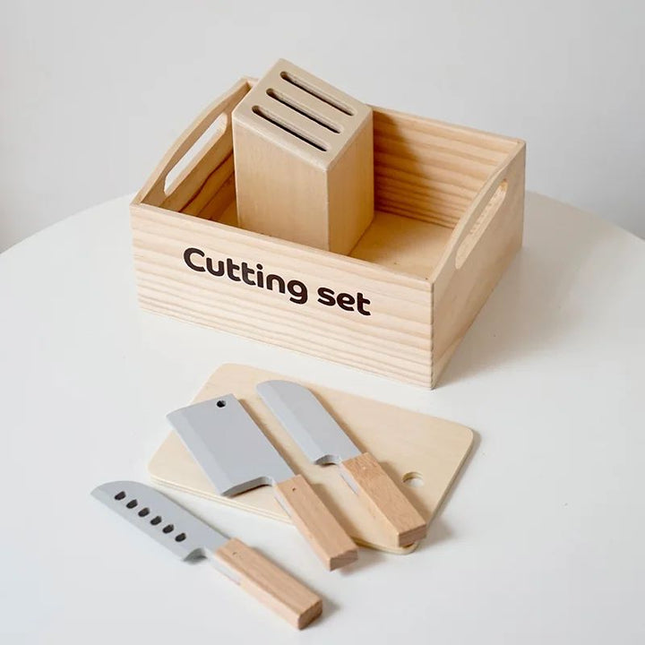 Wooden crate with a toy knife block, cutting board, and play knives
