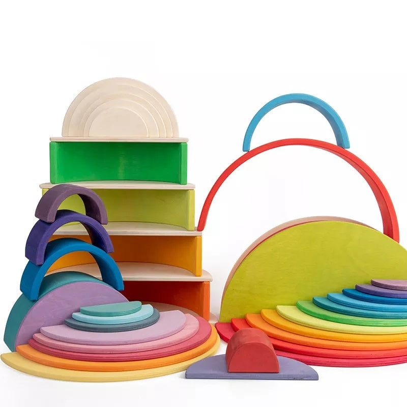 Colorful wooden discs displayed with arches and blocks in several building arrangements