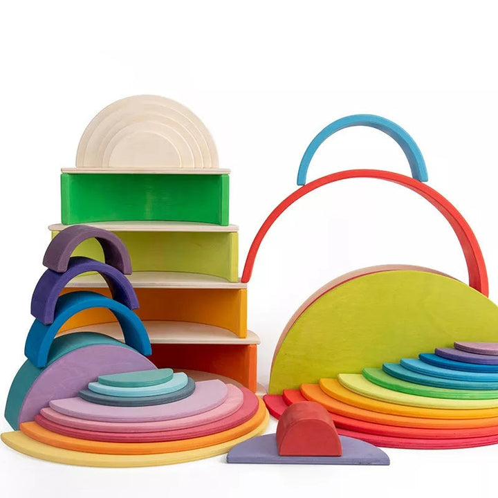 Colorful wooden discs displayed with arches and blocks in several building arrangements