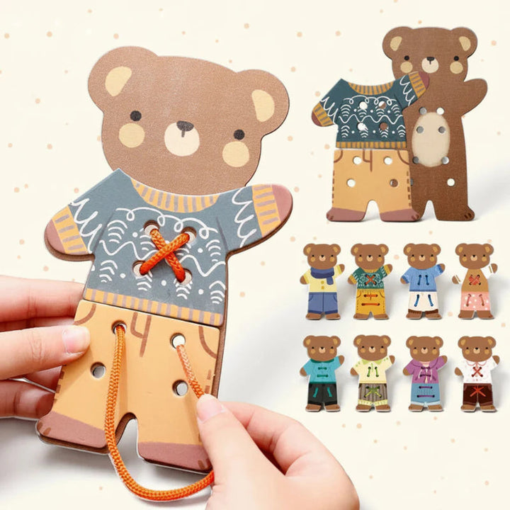 Hands lacing an orange cord through a wooden dress-up bear, with several outfit combinations shown.