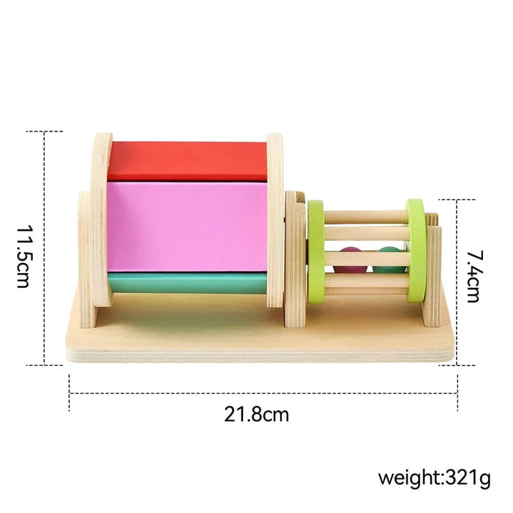 Measurement diagram showing the wooden drum and rattle with labeled dimensions and weight