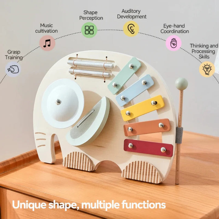 Elephant musical toy with mallet and callouts for listening, grasping, and coordination