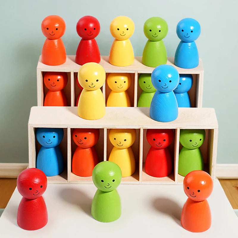 Two wooden sorting racks with colorful smiling figures arranged on a table