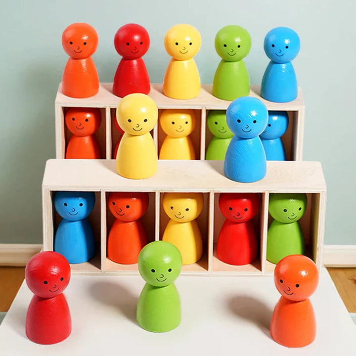 Two wooden sorting racks with colorful smiling figures arranged on a table