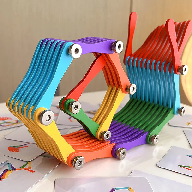 Colorful wooden folding puzzle opened into connected geometric shapes beside pattern cards