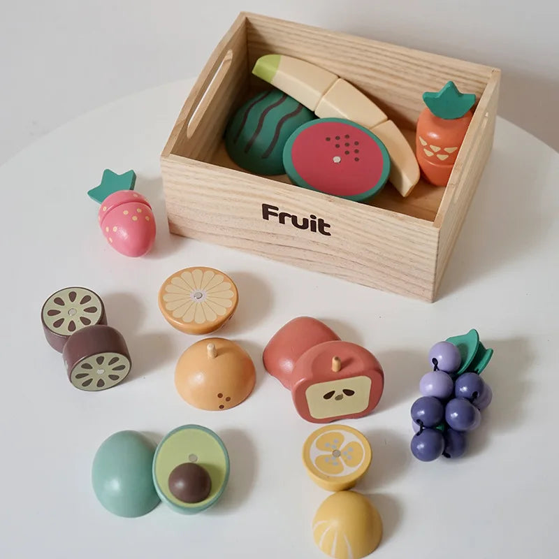 Wooden fruit play food with banana, watermelon, grapes, and a storage crate