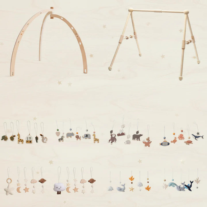 Bentwood and Classical wooden baby gym frames with a selection of themed hanging toys.