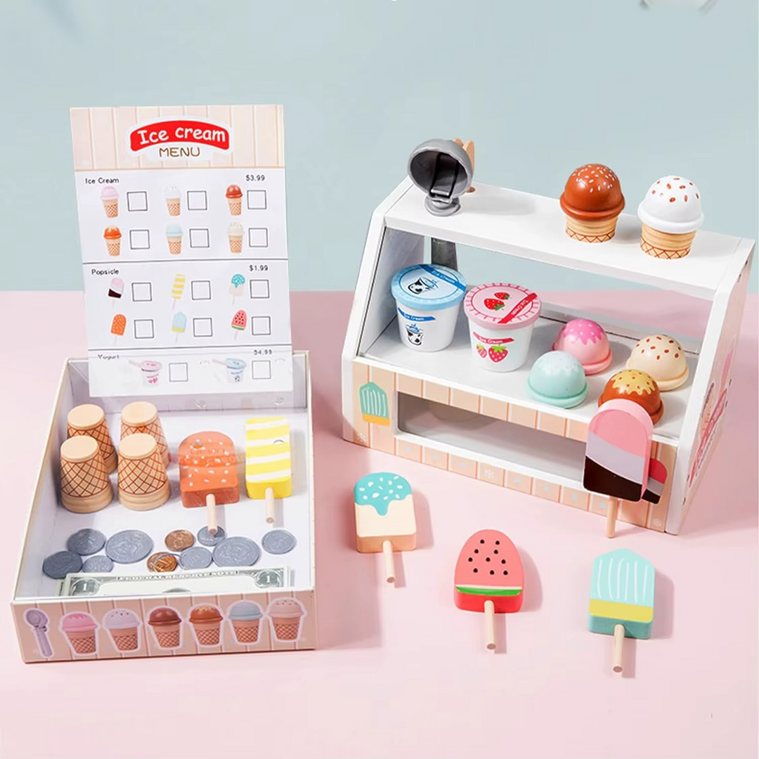 Ice cream counter and serving tray arranged with a menu, cones, cups, and colorful popsicles
