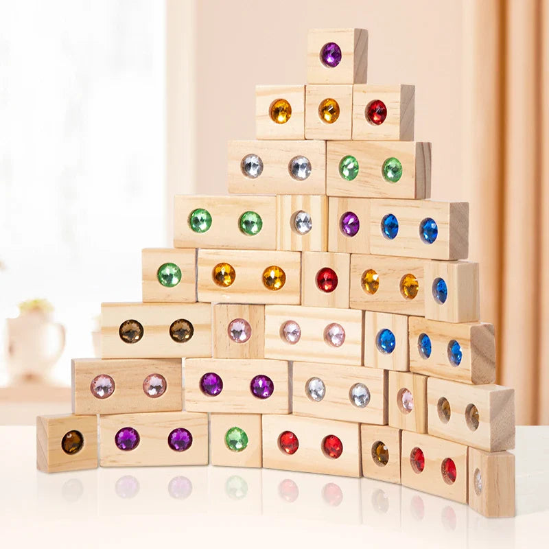 Wooden blocks with colorful gems stacked into a stepped pyramid