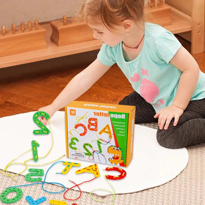 Child choosing a green number piece from a wooden letter and number lacing set