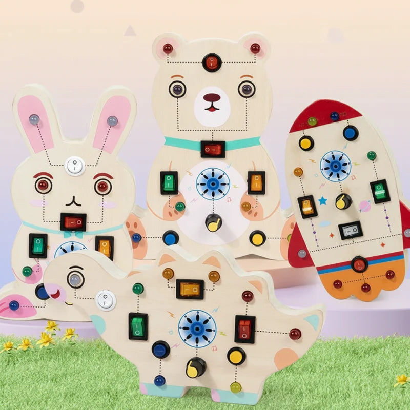 Rabbit, bear, rocket, and dinosaur wooden activity boards with colorful switches and LEDs