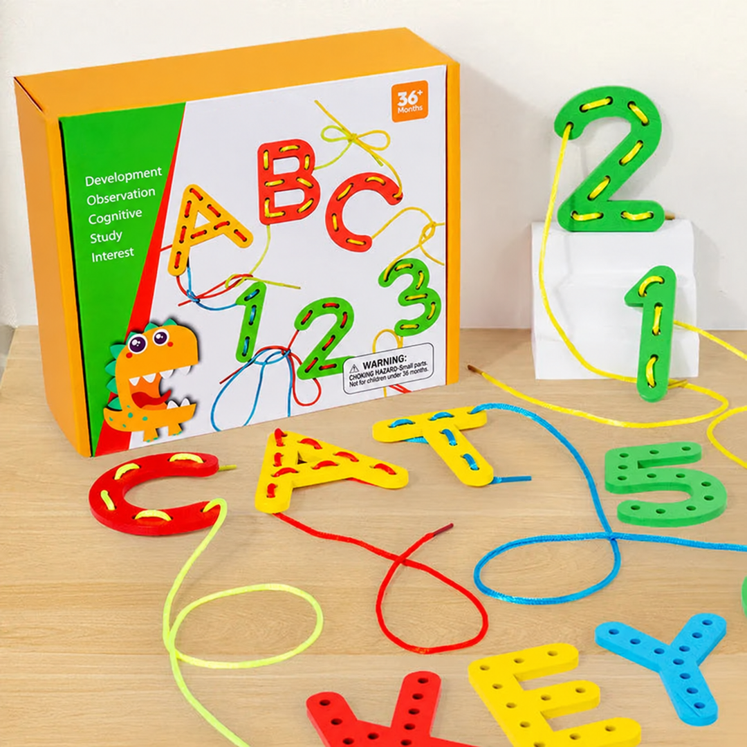 Colorful wooden letter and number lacing pieces with cords beside the box