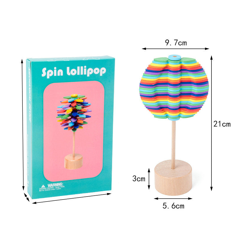 Wooden rotating lollipop toy with its box and measurements for the toy&