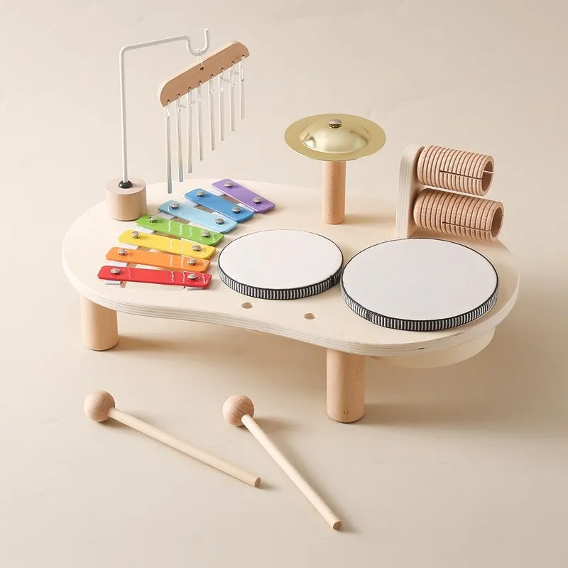 Wooden music playset with two mallets resting beside it