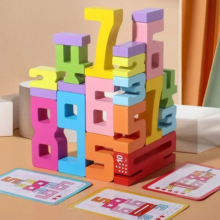 Colorful wooden number blocks stacked into a tower beside pattern cards.