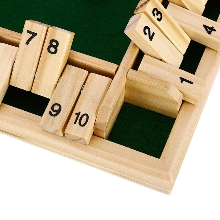 Close-up of wooden number flaps showing raised and lowered positions around the board