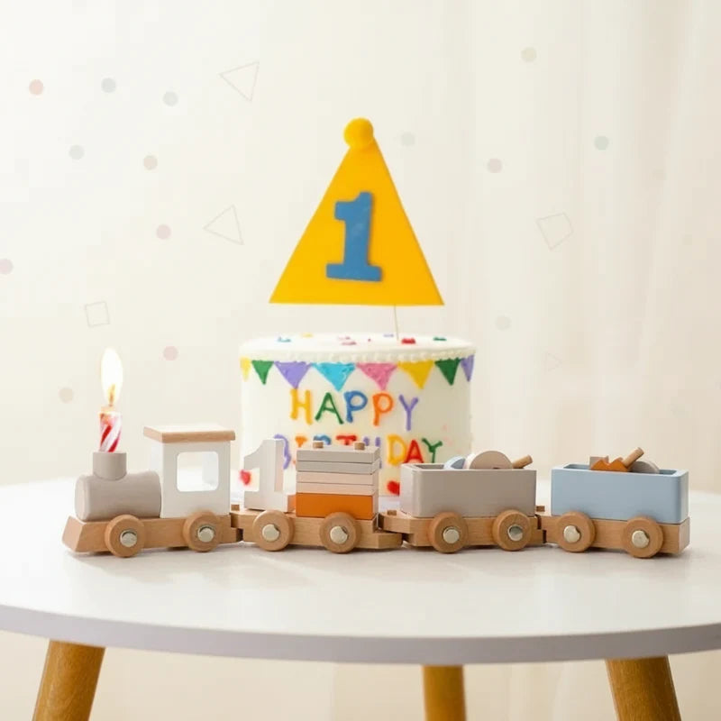 Pastel wooden number train arranged in front of a birthday cake