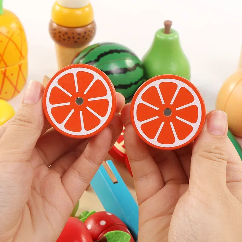 Hands holding two wooden orange halves with magnetic connectors visible