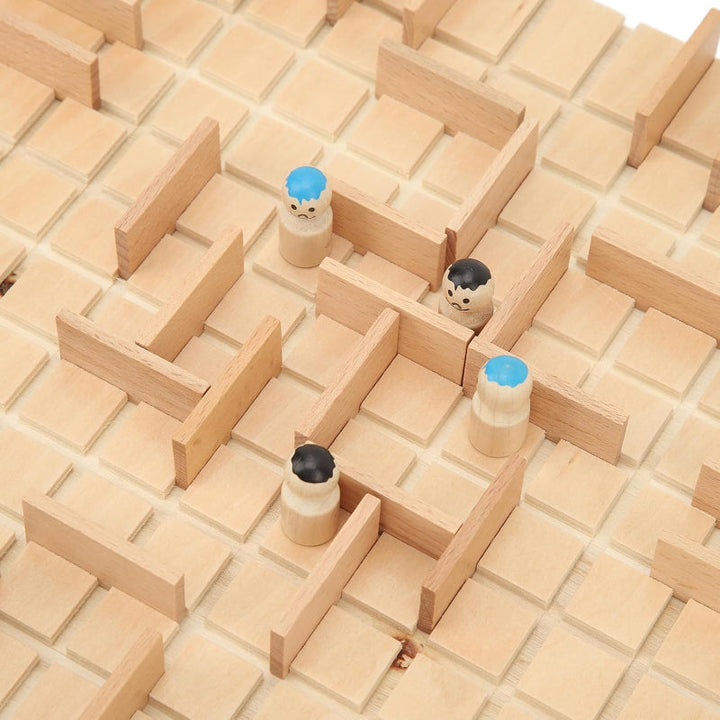 Wooden pawns with blue and black details positioned between barriers on the grid