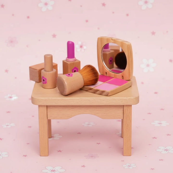 Wooden pretend cosmetics, a brush, and an open compact displayed on a small wooden stool