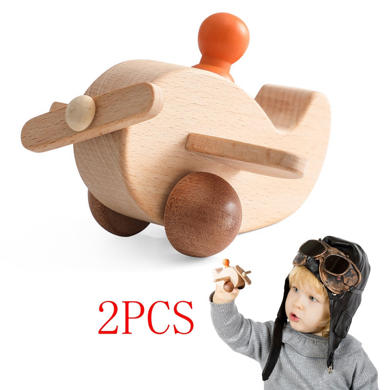 Wooden airplane with a front propeller, wheels, and an orange peg pilot