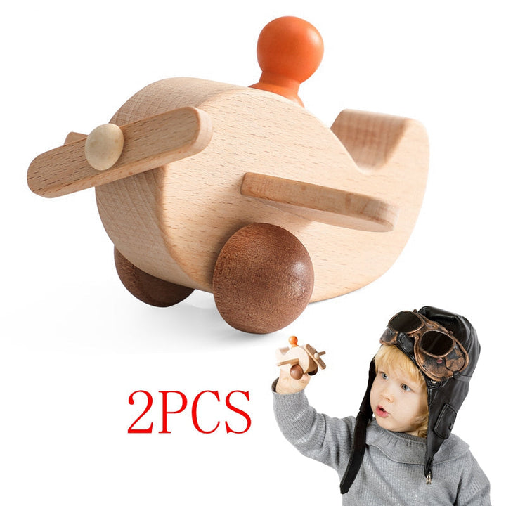 Wooden airplane with a front propeller, wheels, and an orange peg pilot