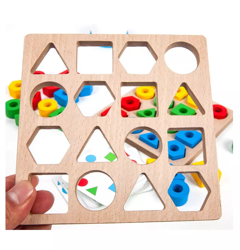 Wooden puzzle board held up to show its geometric cutouts
