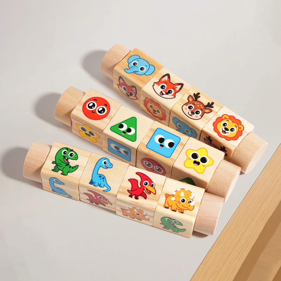 Three wooden rotating cube puzzles with animal, shape, and dinosaur pictures on a tabletop