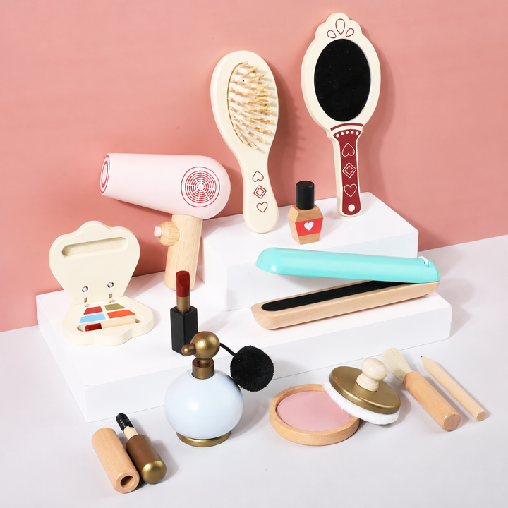 Wooden salon play accessories with a pink hair dryer, turquoise straightener, brush, and mirror