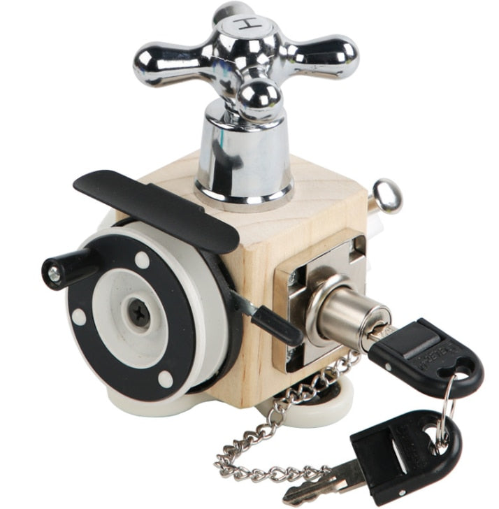 Wooden activity cube with a faucet-style handle, metal lock, and chained keys