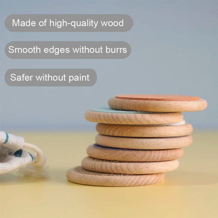 Wooden sensory discs stacked to show their thickness and natural wood edges