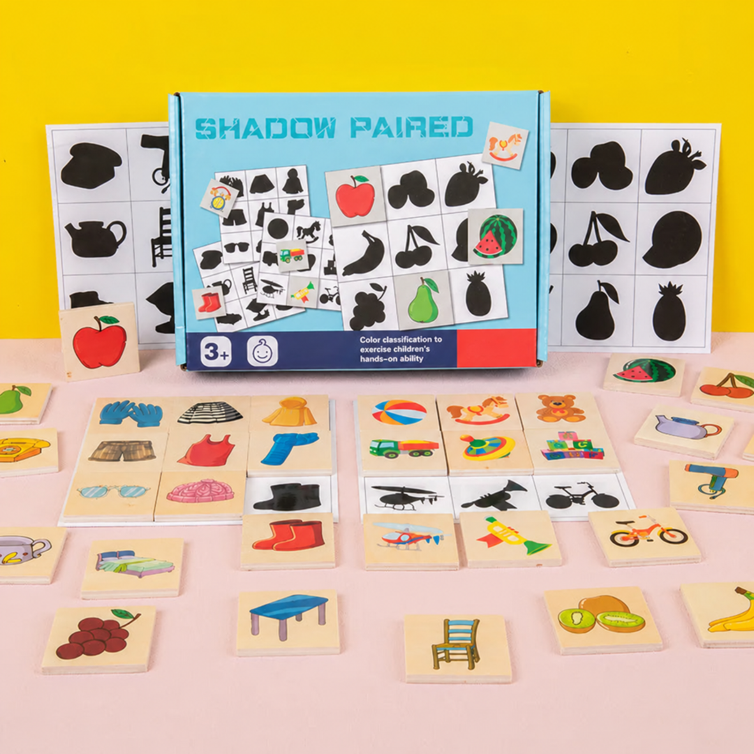 Wooden shadow-matching puzzle with its box, illustrated blocks, and silhouette cards