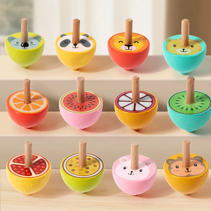 Colorful wooden spinning tops with animal faces and fruit-slice designs