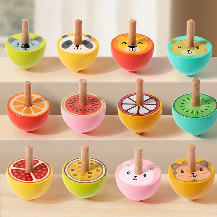 Colorful wooden spinning tops with animal faces and fruit-slice designs