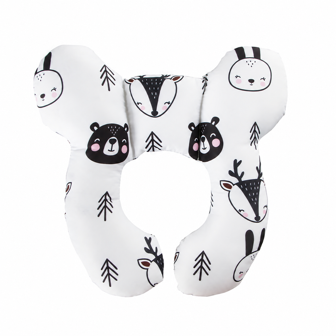 Woodland animal-print pillow with bear, rabbit, and deer faces on a white background