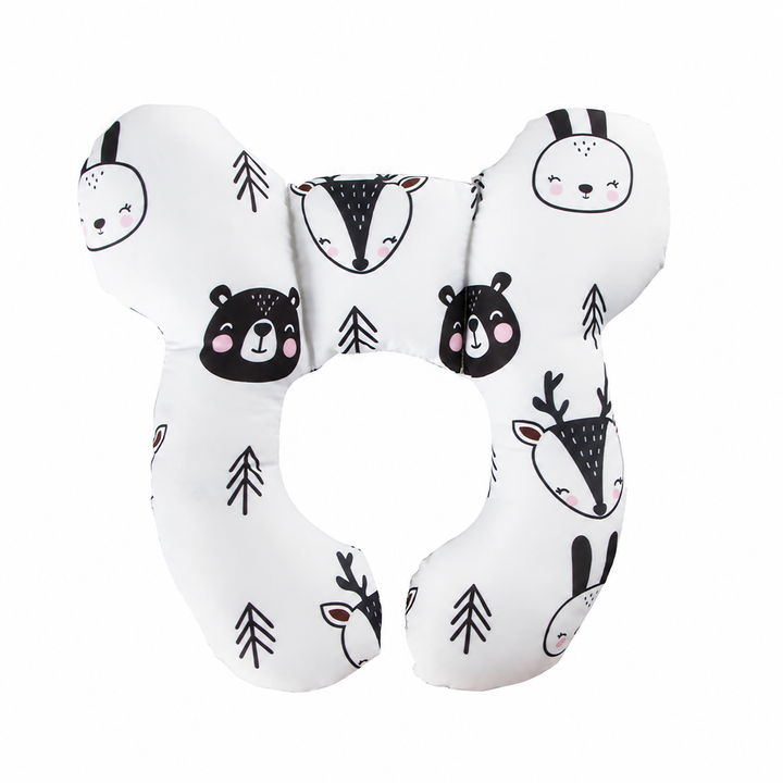 Woodland animal-print pillow with bear, rabbit, and deer faces on a white background