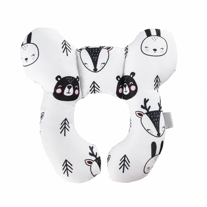 White butterfly-shaped pillow with woodland animal faces and an open center