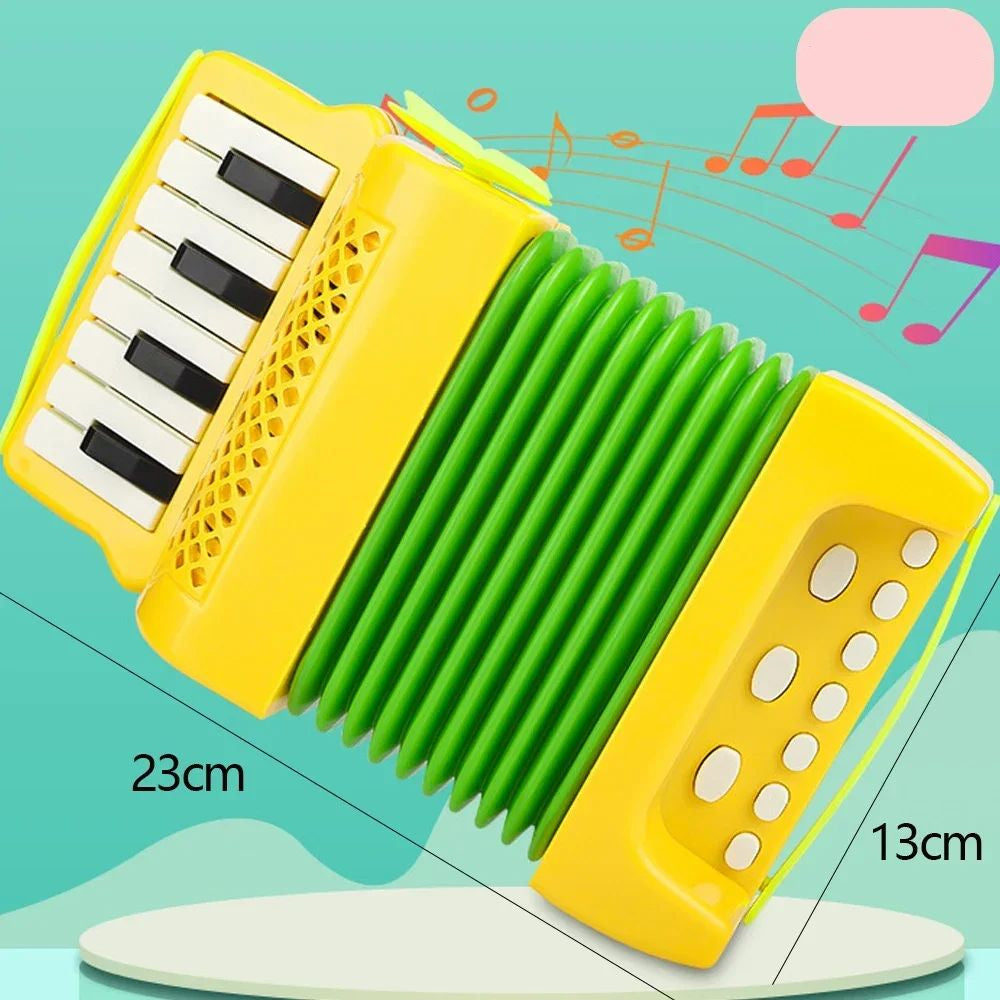 Yellow toy accordion with green bellows and 23 by 13 cm measurements