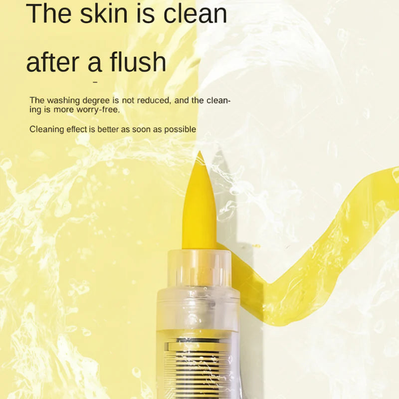 Close-up of a yellow acrylic brush marker tip against a water-splash background